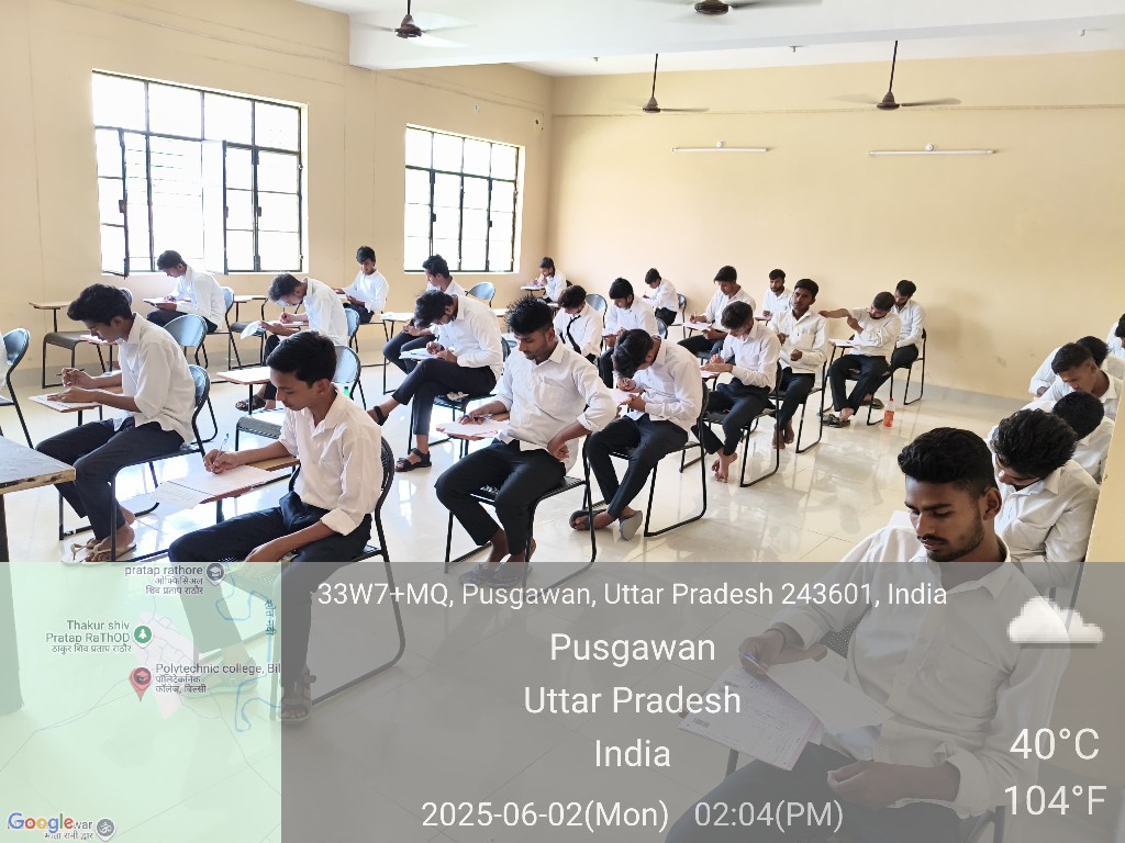 Male students writing examination papers at desks in a bright classroom, June 2, 2025
