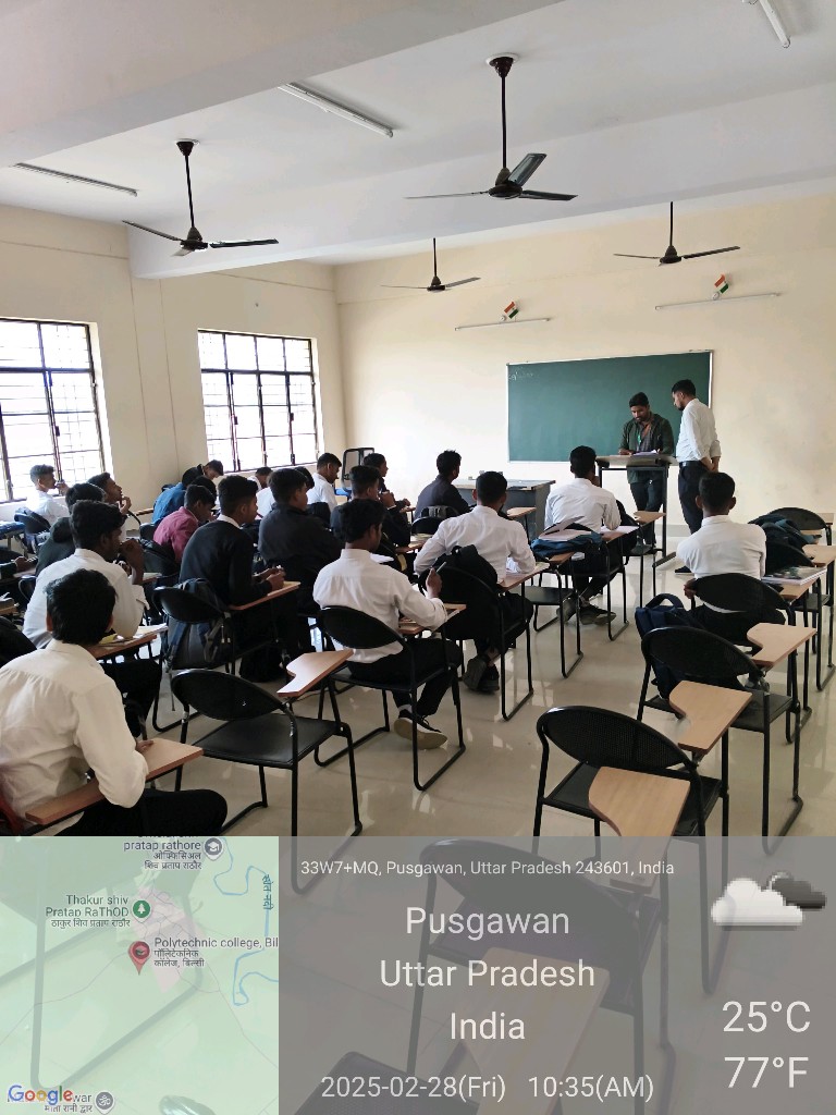 Instructor at chalkboard during a classroom lecture, February 28, 2025