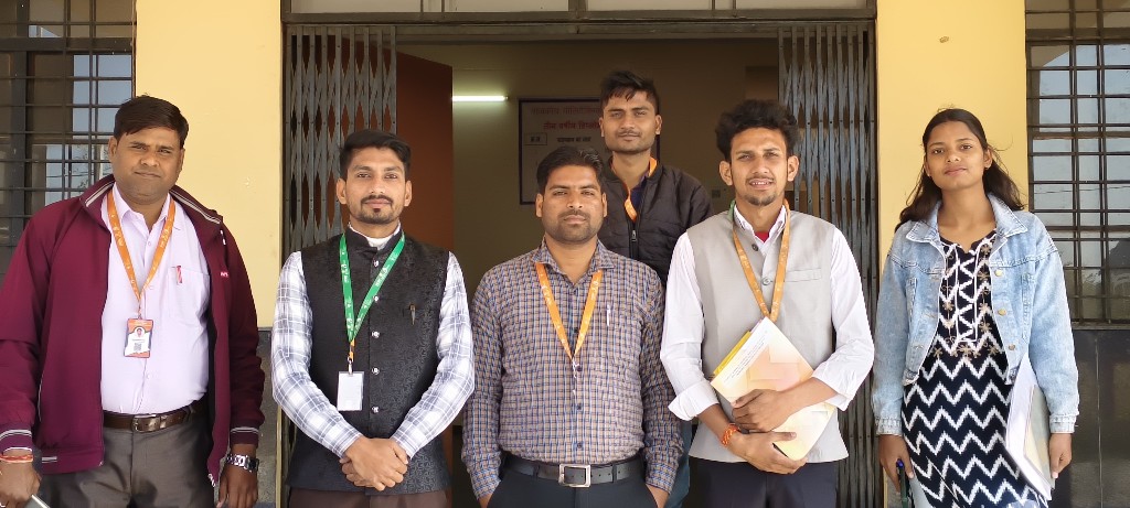 Faculty and staff posing at the main entrance of Government Polytechnic Bilsi
